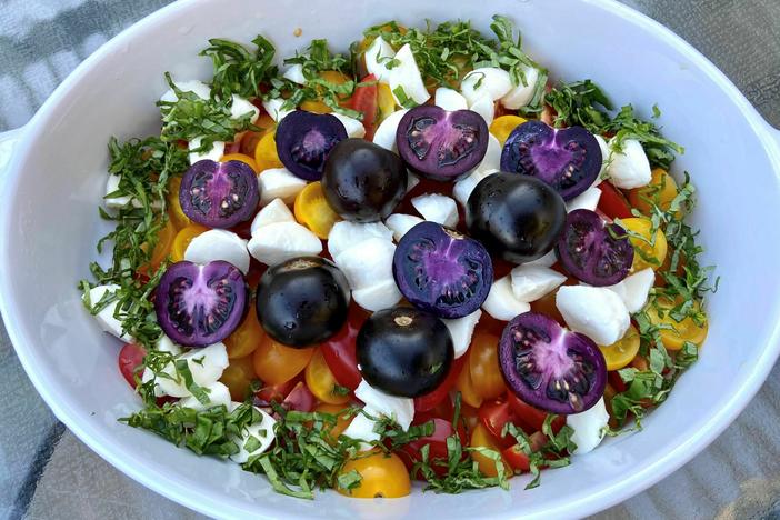 A caprese salad prepared with Norfolk's Purple Tomato. The tomato was created using genes from a snapdragon.