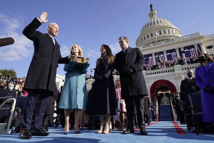 Joe Biden is sworn in as the 46th president of the United States by Chief Justice John Roberts as Jill Biden holds the Bible during the 59th Presidential Inauguration at the U.S. Capitol in Washington, Wednesday, Jan. 20, 2021.