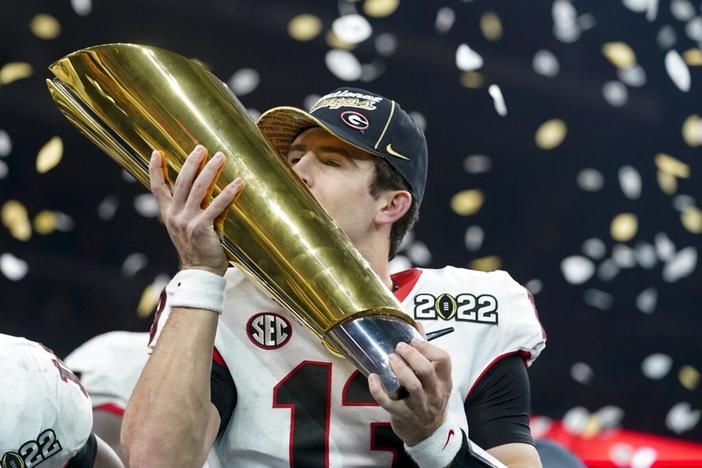Georgia quarterback Stetson Bennett celebrates after winning the college football national championship against Alabama Tuesday, Jan. 11, 2022, in Indianapolis. Stetson was named offensive MVP in the Bulldog's 33-18 win over Alabama. 
