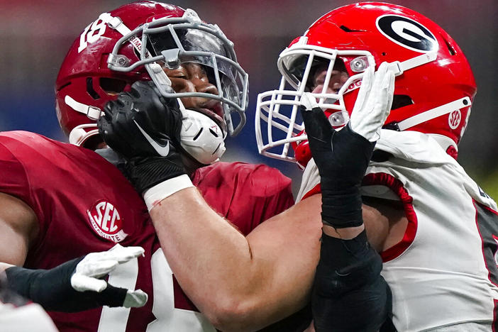 Georgia offensive lineman Warren Ericson (50) and Alabama wide receiver Slade Bolden (18) play during the second half of the Southeastern Conference championship NCAA college football game, Saturday, Dec. 4, 2021, in Atlanta. Those Georgia Bulldogs aren't the only ones having a devil of a time beating fellow Southeastern Conference powerhouse Alabama. They're just the only one that gets another shot in the biggest game of them all. 