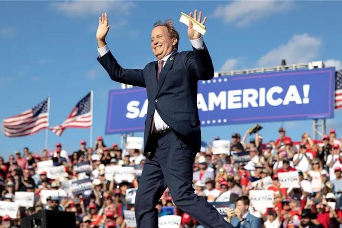 Texas Attorney General Ken Paxton waves to the crowd during a rally featuring former President Donald Trump on Oct. 22, 2022, in Robstown, Texas.