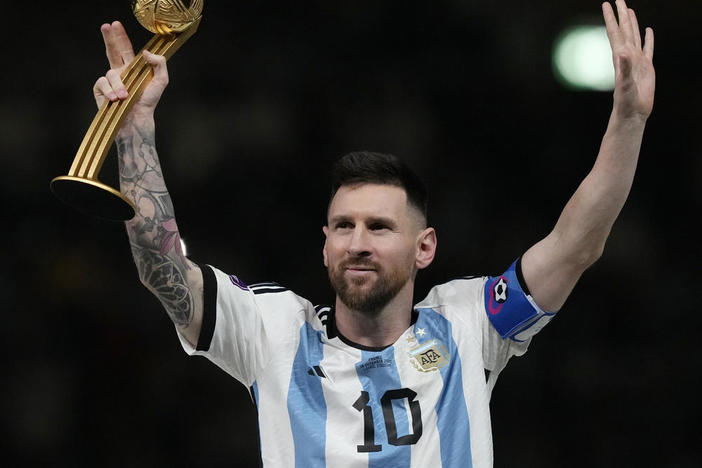 Argentina's Lionel Messi waves after receiving the Golden Ball award for best player of the tournament at the end of the World Cup final soccer match between Argentina and France at the Lusail Stadium in Lusail, Qatar, Sunday, Dec. 18, 2022.