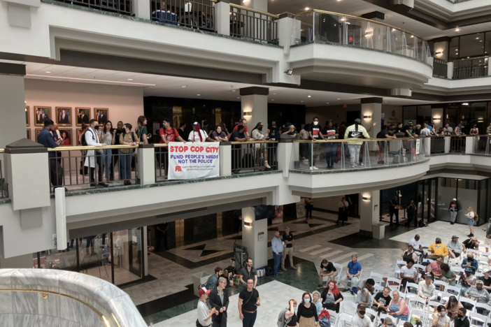 Hundreds rallied in the atrium of Atlanta City Hall on Monday to show and voice their opposition to the planned public safety training center. The City Council is expected to vote Monday on funding the center. 