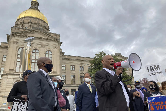  African Methodist Episcopal Church Bishop Reginald Jackson announces a boycott of Coca-Cola Co. products outside the Georgia Capitol on March 25, 2021 in Atlanta.