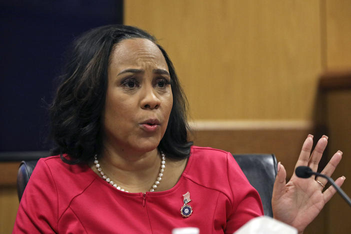 Fulton County District Attorney Fani Willis testifies during a hearing on the Georgia election interference case, Thursday, Feb. 15, 2024, in Atlanta. The hearing is to determine whether Willis should be removed from the case because of a relationship with Nathan Wade, special prosecutor she hired in the election interference case against former President Donald Trump. 