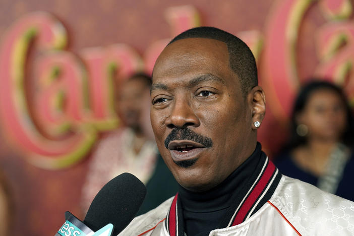 Eddie Murphy, a cast member in "Candy Cane Lane," is interviewed at the premiere of the film at the Regency Village Theatre, Tuesday, Nov. 28, 2023, in Los Angeles. 