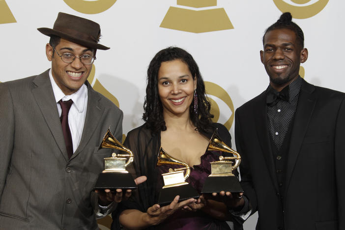 Musicians Dom Flemons, Rhiannon Giddens and Justin Robinson, of the Carolina Chocolate Drops, pose with the award for best traditional folk album at the Grammy Awards. Their music is inspired by the Appalachian region.