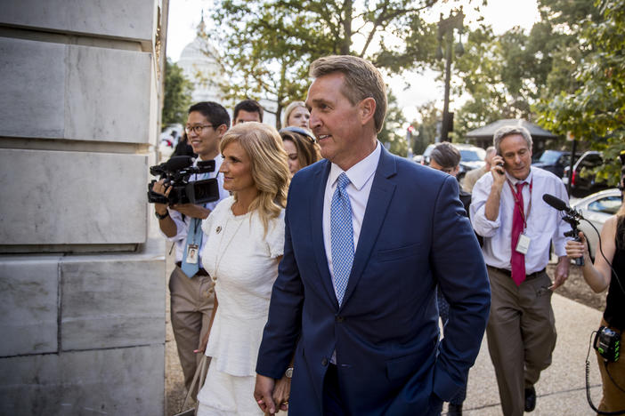 Sen. Jeff Flake, R-Ariz., accompanied by his wife Cheryl, leaves the Capitol in Washington, Tuesday, Oct. 24, 2017, after announcing he won't seek re-election in 2018. 