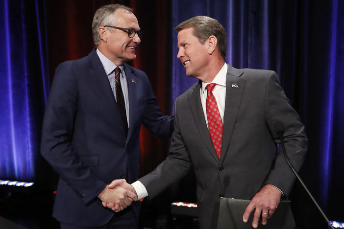 In this July 12, 2018, file photo, Georgia Republican gubernatorial candidates, Lt. Gov. Casey Cagle, left, and Secretary of State Brian Kemp shake hands after an Atlanta Press Club debate at Georgia Public Television in Atlanta.