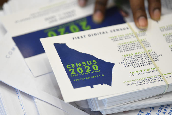 A worker gets ready to pass out instructions on how fill out the 2020 census during an August 2019 town hall meeting in Lithonia, Ga.