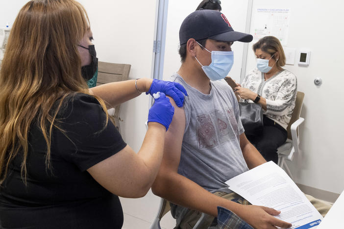 This 16-year-old got a Pfizer-BioNTech COVID-19 shot late last month at the UCI Health Family Health Center in Anaheim, Calif. Students as young as 12 are now eligible to get the vaccine, too, the FDA says.