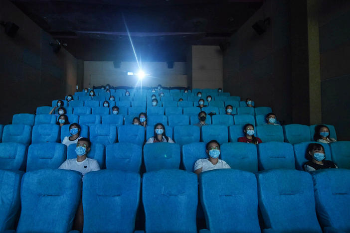 Audience members sit separately for social distancing at a cinema in China's eastern Zhejiang province in July 2020.