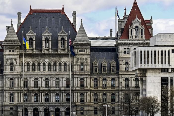 The New York state Capitol building (left) is shown next to the state appellate court building in foreground (right) on April 4 in Albany, N.Y.