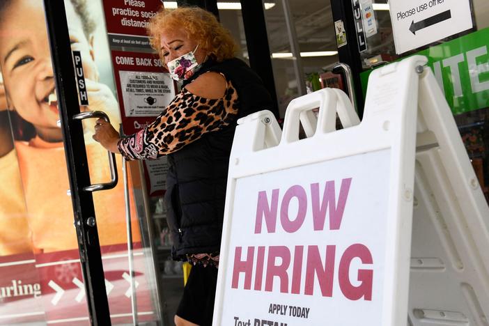 A 'now hiring' sign is displayed outside of a Burlington Coat Factory retail store in downtown Los Angeles on March 11.