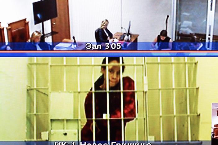U.S. basketball player Brittney Griner, who was sentenced to nine years in a Russian penal colony in August for drug smuggling, is seen on a screen via a video link from a remand prison during a court hearing to consider an appeal against her sentence, at the Moscow regional court on Oct. 25.