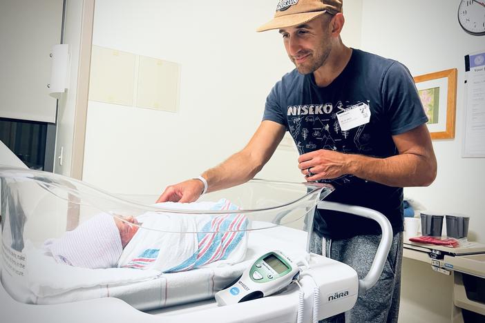 Greg Rosalsky looks at his new son in the hospital.
