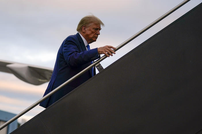 Republican presidential candidate and former President Donald Trump boards his plane at Manchester-Boston Regional Airport on Monday.