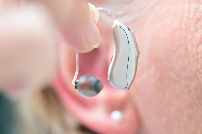 People who consistently wear hearing aids have a lower chance of falling, a new study finds.