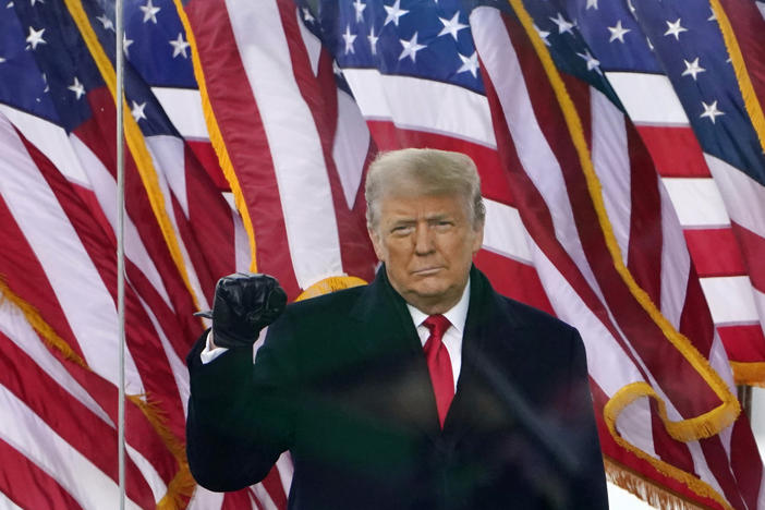 Then-President Donald Trump gestures as he arrives to speak at a rally in Washington, D.C., on Jan. 6, 2021.