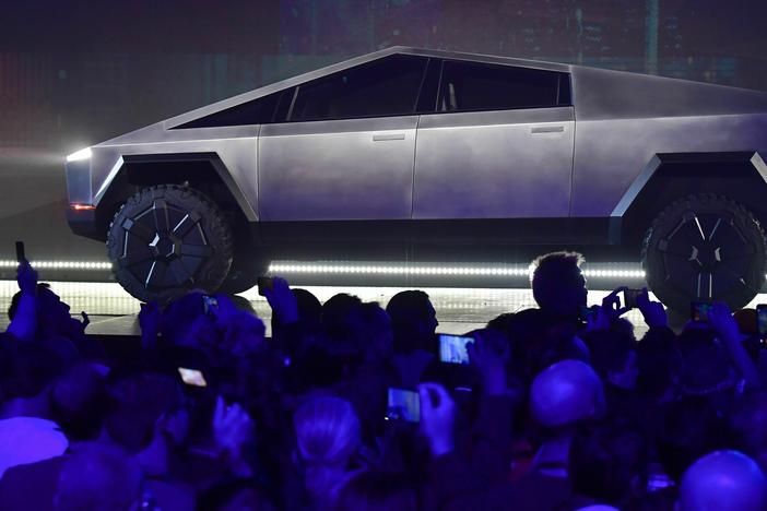 Tesla's Cybertruck, pictured here during its design reveal in Hawthorne, Calif., in 2019, is finally rolling out of factories a full two years after the initial delivery target.