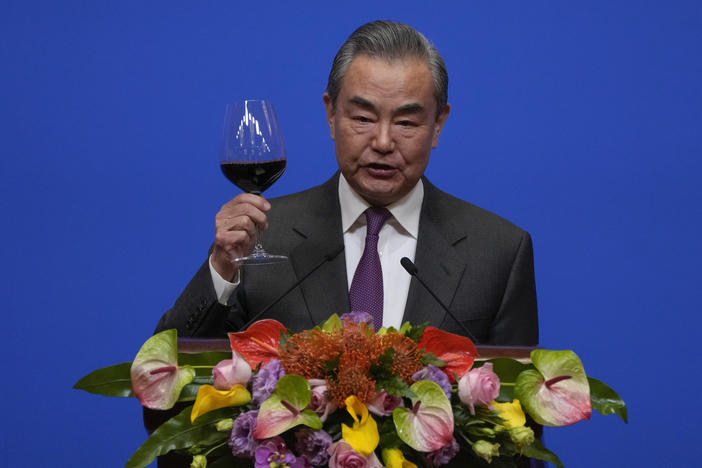 Chinese Foreign Minister Wang Yi gives a toast to invited guests after delivering a speech at a reception for Commemoration of the 45th Anniversary of China-U.S. Diplomatic Relations in Beijing on Friday.
