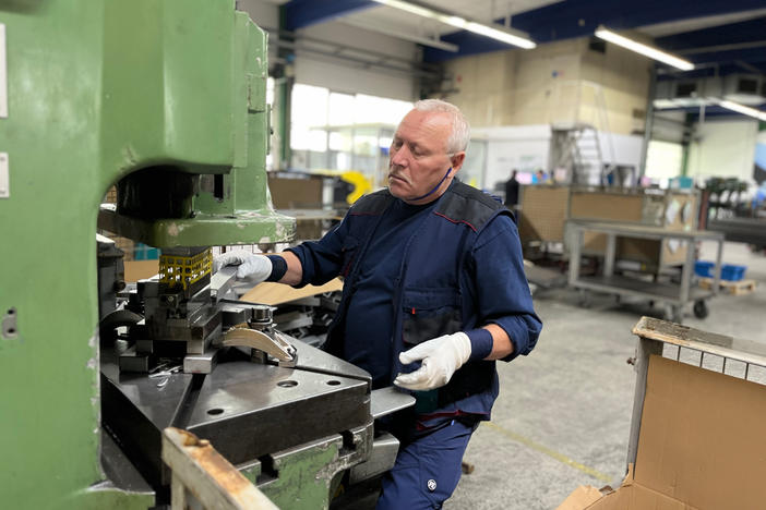 A worker at Munk Group in Günzburg, Germany, punches holes into a part that will be used to construct a ladder. After years of using Chinese suppliers, Munk Group recently decided to cut off all business with China. Germany's government has cautioned all German businesses to be careful about not depending too heavily on China, a strategy known as "de-risking."