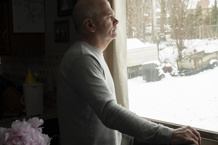 Tim Lillard at the home he and his late wife, Ann Picha-Lillard, shared in suburban southeast Michigan. Since her death in 2022, Lillard has made it his mission to pass the Safe Patient Care Act, which would create mandatory nurse-to-patient ratios in Michigan hospitals.