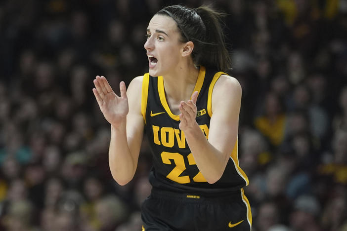 Iowa guard Caitlin Clark claps during the second half of a game against Minnesota on Wednesday in Minneapolis.
