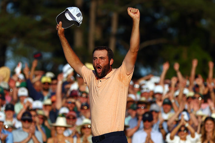 Scottie Scheffler celebrates on the 18th green after winning the 2024 Masters Tournament at Augusta National Golf Club on Sunday in Augusta, Ga.