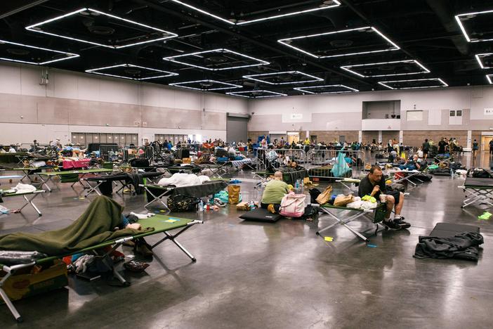 People rest at a cooling station in Portland, Oregon during the deadly Northwest heat dome of 2021. Climate change has made heat risks more dangerous across the country. A new heat forecasting tool could help people stay safe.