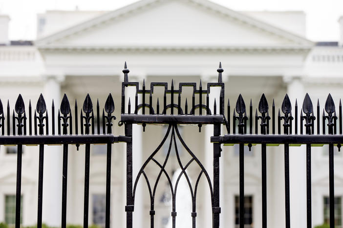 FILE - The White House is visible through the fence at the North Lawn in Washington, on June 16, 2016. A driver died Saturday night, May 4, 2024 after crashing a vehicle into a gate at the White House, authorities said.