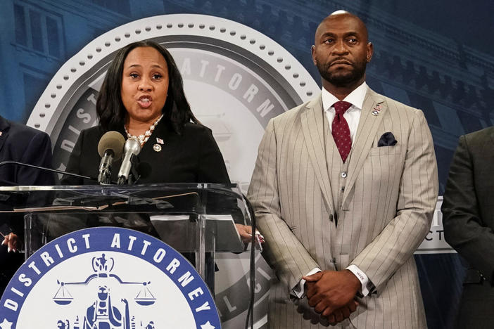 Fulton County District Attorney Fani Willis speaks at a news conference next to prosecutor Nathan Wade after a Grand Jury brought back indictments against former president Donald Trump and his allies in their attempt to overturn the state's 2020 election results, in Atlanta on Aug. 14, 2023. Photo by Elijah Nouvelage/ Reuters