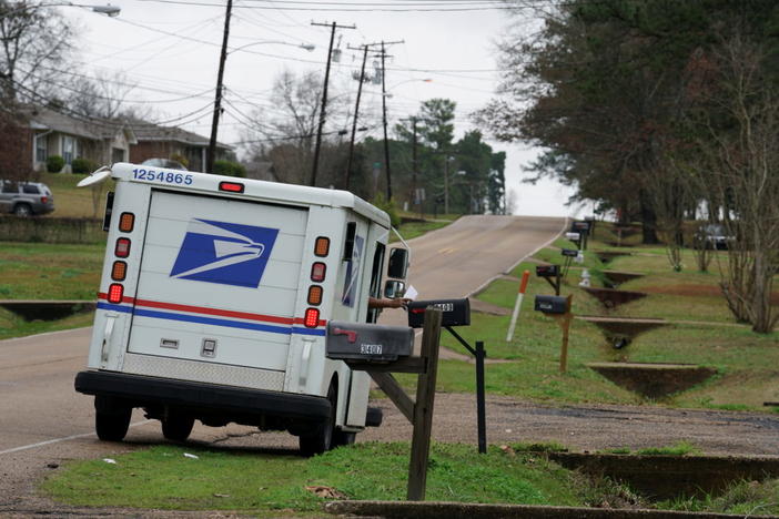 FILE PHOTO: A mail carrier delivers the mail in Pearl, Mississippi, U.S. January 15, 2020. Picture taken January 15, 2020. REUTERS/Veronica G. Cardenas/File Photo