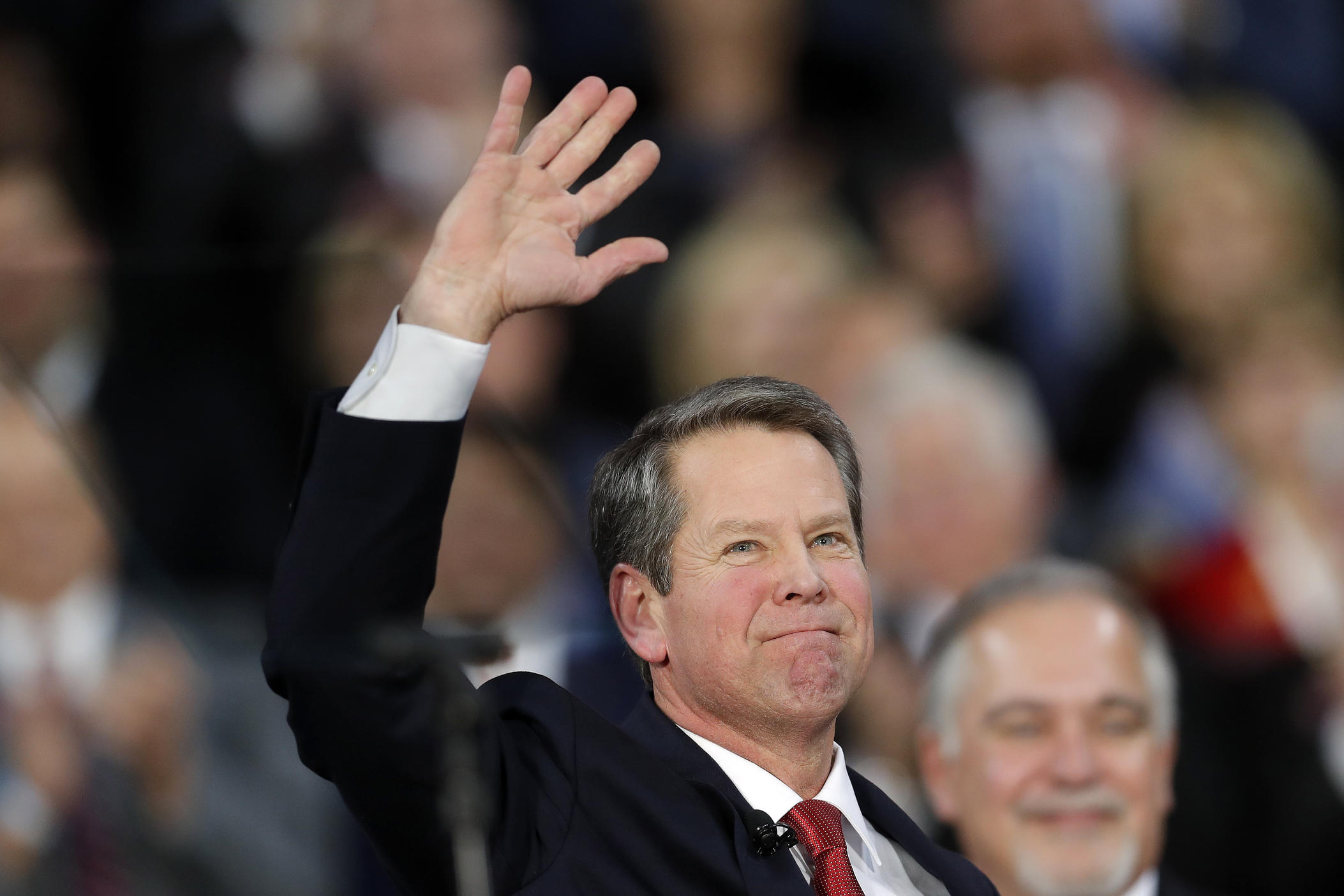 Governor Brian Kemp waving 