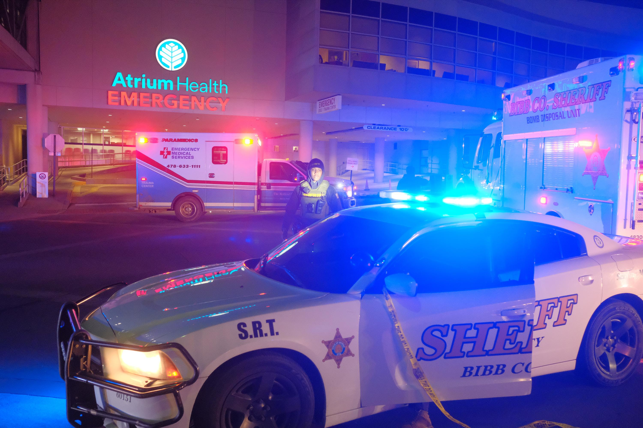 Law enforcement surrounds the entrance of Atrium Health Navicent in Macon, Ga. on Jan. 18, 2024. It is the only American College of Surgeons Committee on Trauma verified Level I trauma center in middle Georgia 