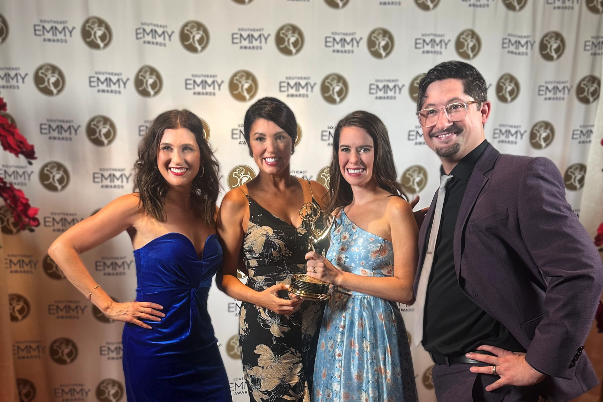 GPB staff holding an Emmy award