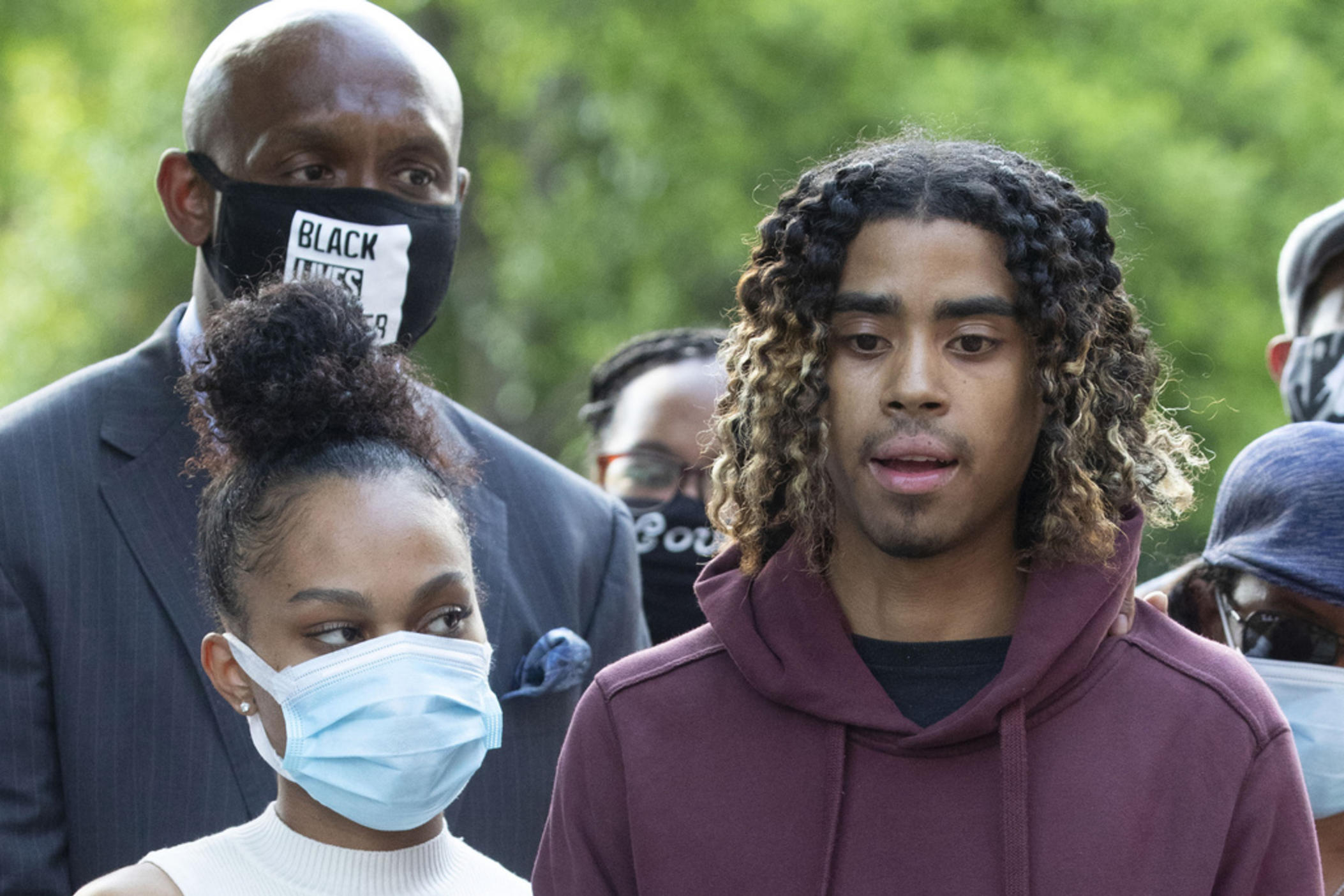 Taniyah Pilgrim, left, stands with Messiah Young, right, as he speaks during a news conference on the campus of Morehouse College, June 1, 2020, in Atlanta. On Monday, July 1, 2024, the Atlanta City Council approved the payment of a settlement of $2 million to the two college students who were shocked with Tasers and pulled from a car while they were stuck in downtown traffic caused by protests over George Floyd's killing. 