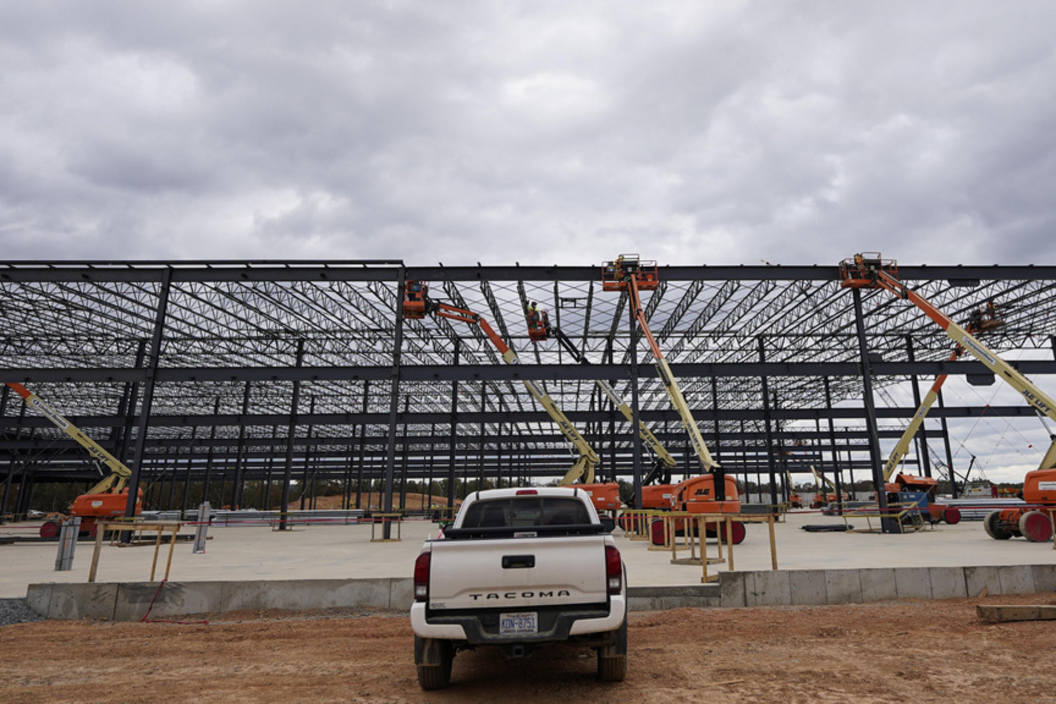 JLG lifts are operated outside a Hanwha QCells Solar plant Oct. 16, 2023, in Cartersville, Ga. 