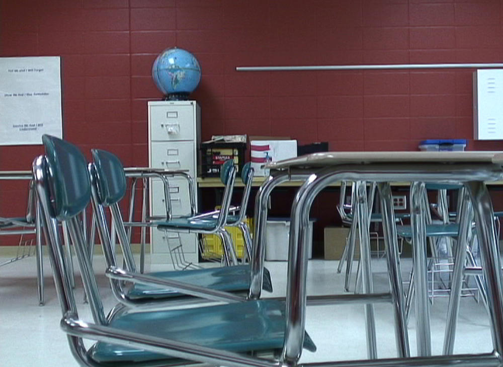 Empty desks in a public school in this file photo from 2010.