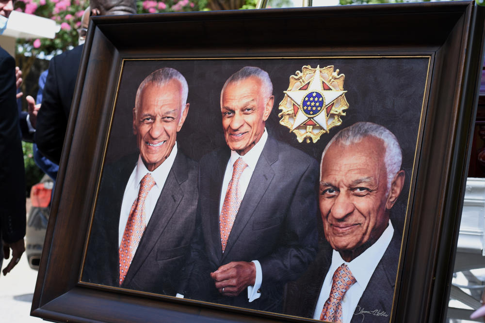 A portrait of the late Rev. Dr. C.T. Vivian is on display next to his casket.