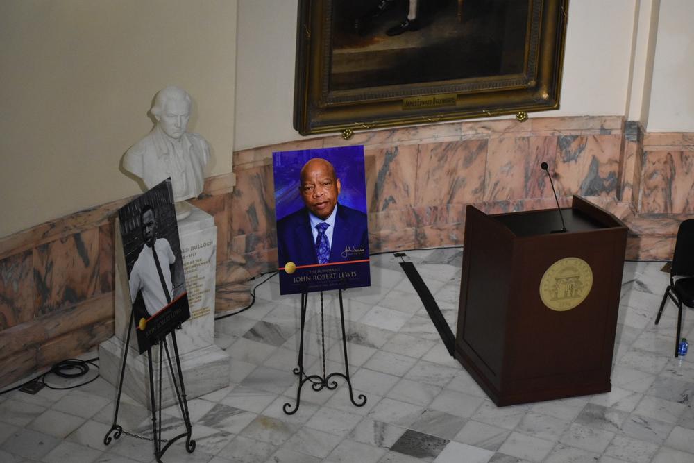A picture of Lewis stands by the podium where state officials gave speeches on Lewis in the state capitol.