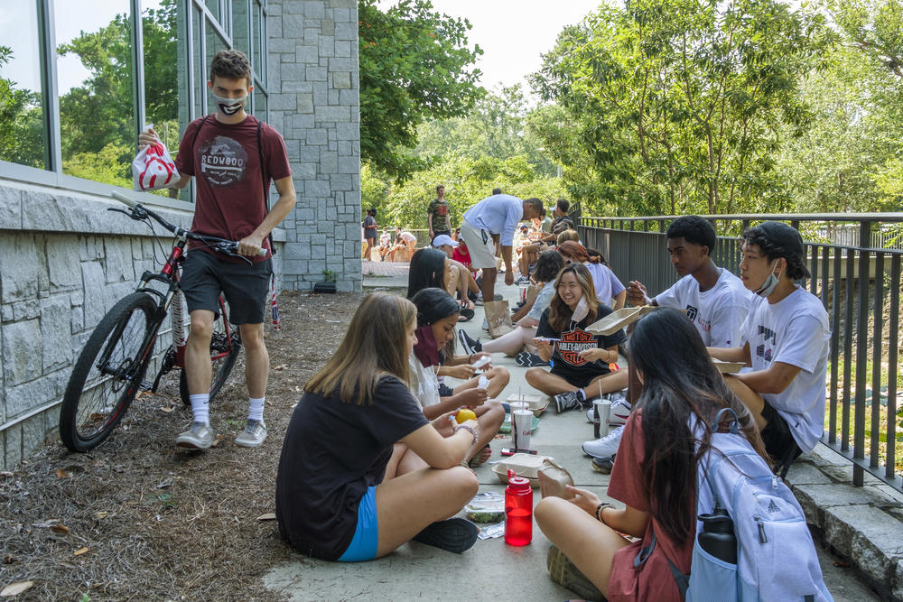 University of Georgia freshmen eat lunch behind one of the main dining halls where inside dining is by reservation only. 