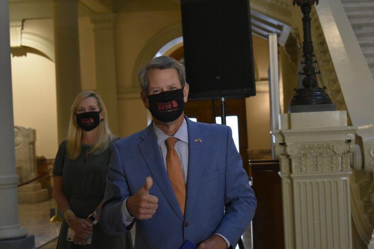 Gov. Brian Kemp and first lady Marty Kemp enter the Capitol with 2020 Census face masks. Kemp is seeking to boost the state's participation rate as the Sept. 30 deadline looms. 