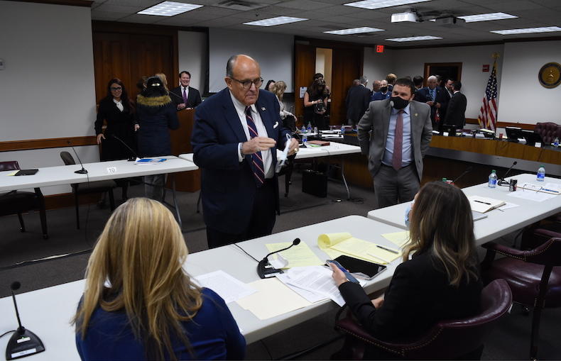 Rudy Giuliani talks with Georgia State Sens. Jen Jordan (D-Atlanta) and Elena Parent (D-Atlanta) during a break in a Georgia State Senate hearing Thursday, Dec. 3, 2020.