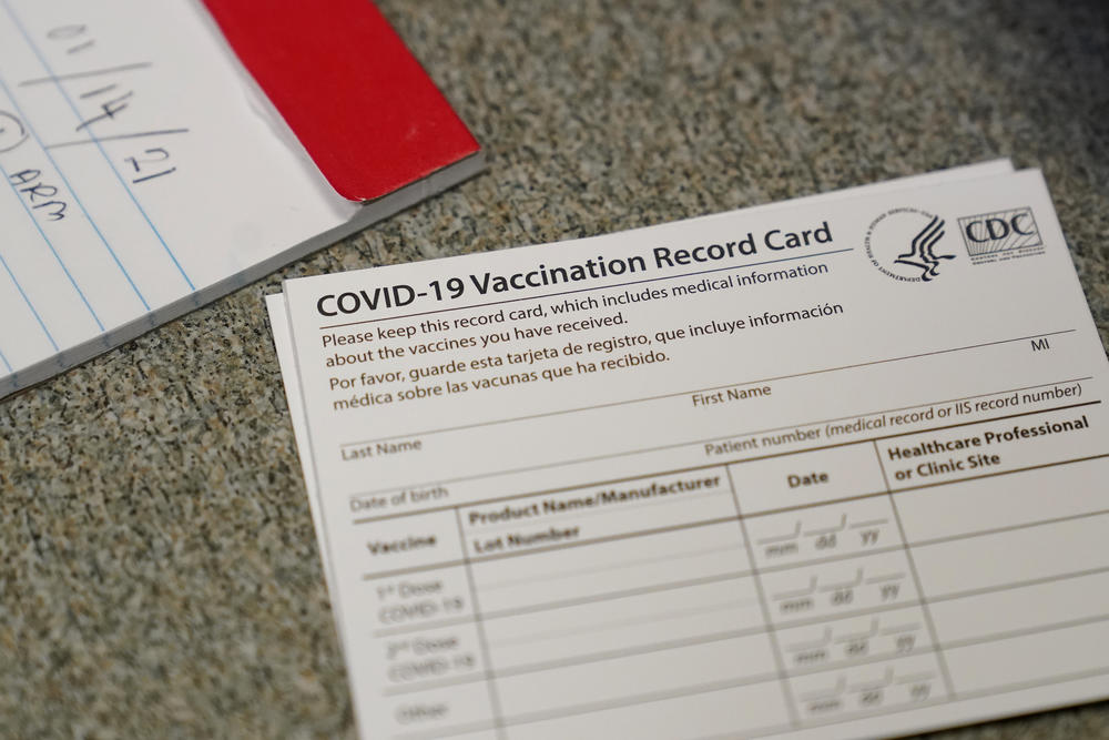 A COVID-19 vaccination record card is shown at Seton Medical Center during the coronavirus pandemic.