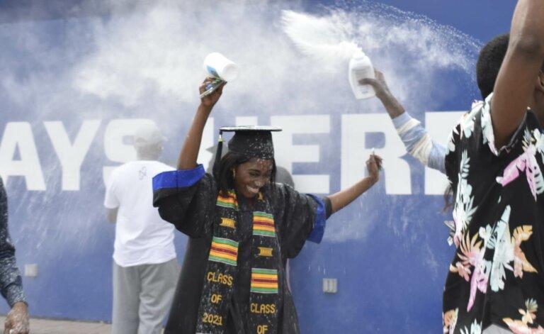 Grace Mbenza was surprised with baby powder confetti after graduating at Georgia State University's Center Parc Stadium.