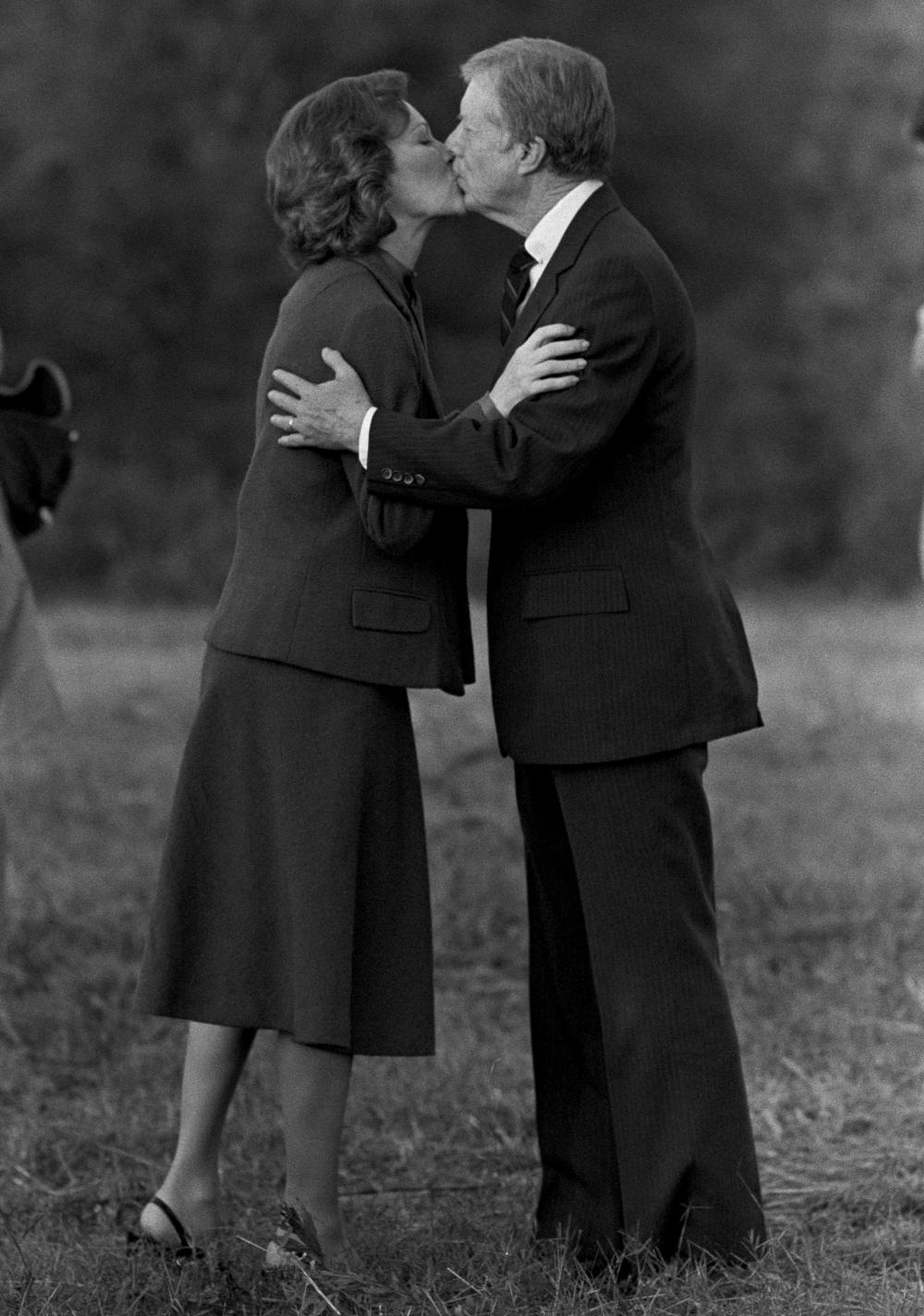 U.S. President Jimmy Carter kisses his wife, Rosalynn, as he arrives in Plains, Ga., Tuesday, Nov. 4, 1980.