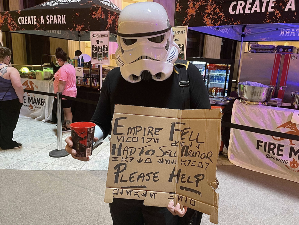 A Dragon Con 2021 attendee cosplays a stormtrooper down on his luck.