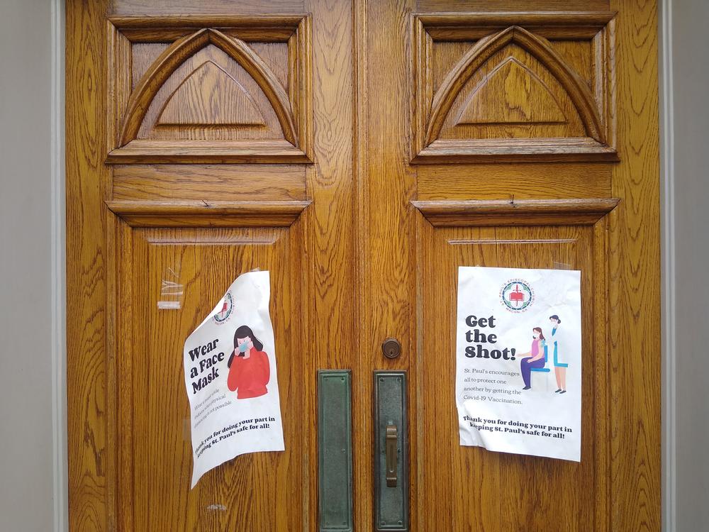 Signs exhorting church members to both mask and get vaccinated against COVID-19 on the doors to the sanctuary of St. Paul Episcopal Church in Macon. 