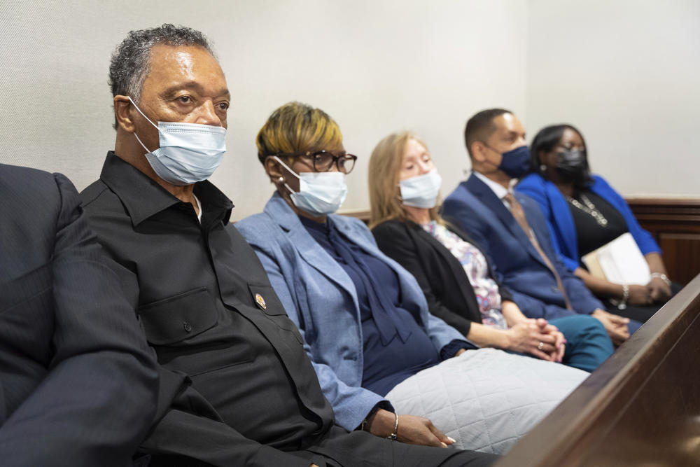 Rev. Jesse Jackson, left, sits with Wanda Cooper-Jones, mother of Ahmaud Arbery, during the trial of Arbery at the Glynn County Courthouse on Thursday, Nov. 18, 2021 in Brunswick, Ga.